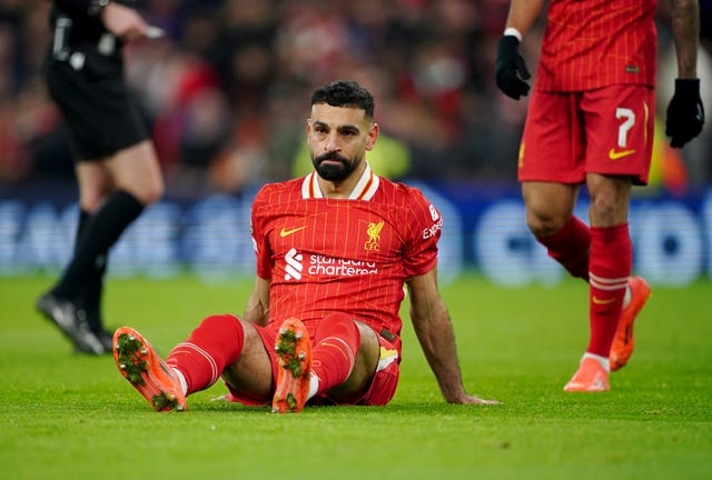 Liverpool’s Mohamed Salah reacts after missing a penalty kick