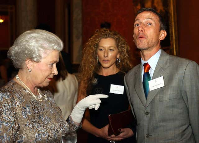 Queen Elizabeth II meets designers Patrick Cox and Kelly Hoppen during a reception at Buckingham Palace, London, to mark the contribution made by the British design industry