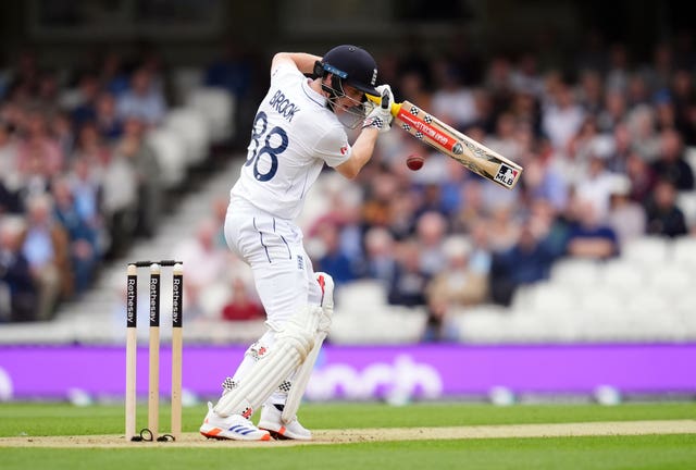 Harry Brook, with a Major League Baseball sticker on his bat, plays a back-foot shot to a short ball outside off stump