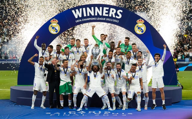 Real Madrid’s Marcelo lifts the trophy as they celebrate winning the Champions League against Liverpool