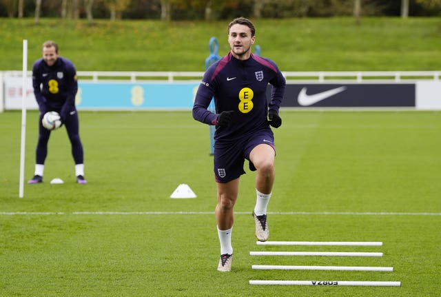 Taylor Harwood-Bellis runs during an England training session