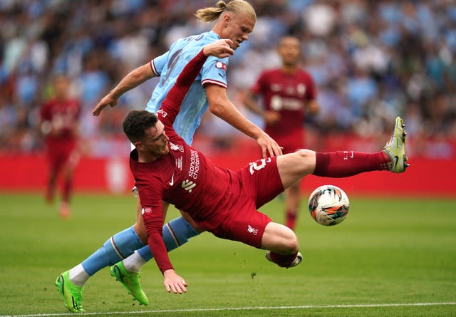 Manchester City’s Erling Haaland and Liverpool’s Andrew Robertson