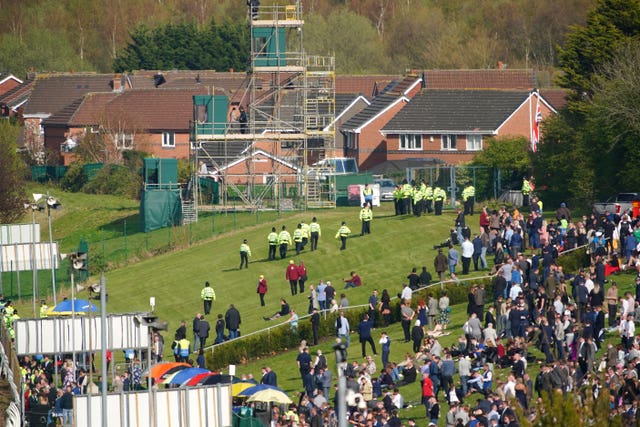 Police officers respond to Animal Rising activists