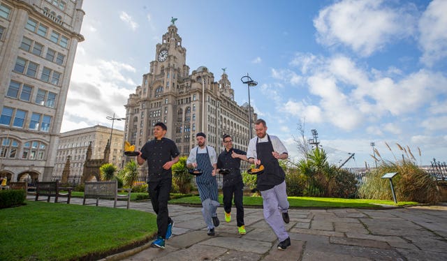 Mauricio Ortegon, Chris Rushton, Jehu Cuello and Adam Gibson take part in the chefs race in Liverpool