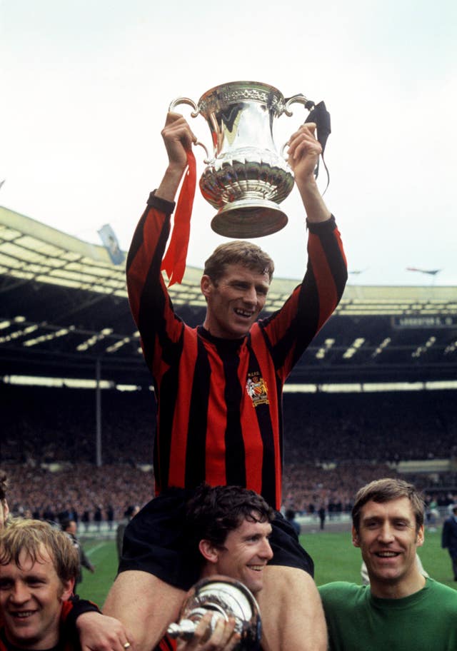 Tony Book is carried on Mike Doyle’s shoulders as Manchester City celebrate FA Cup success in 1969 