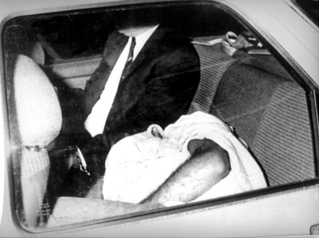 A man thought to be Colin Pitchfork is driven from Leicester Magistrates' Court after he was charged with the rape and murders of Lynda Mann and Dawn