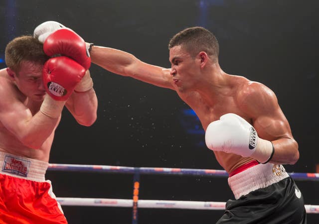 Ogogo (right) won his first 11 professional boxing fights before suffering his injury.