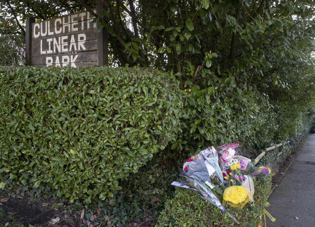 Floral tributes at the scene in Culcheth Linear Park 