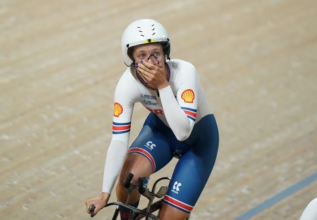 Josie Knight after finishing a race, with her hand to her mouth in disbelief.