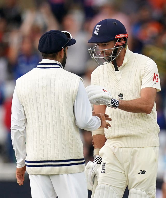 England's Jimmy Anderson, right, exchanges words with India's Virat Kohli
