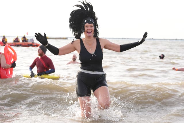 People take part in the Southend RNLI New Year's Day Dip in Southend-on-Sea, Essex
