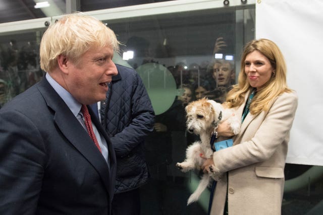 Boris Johnson and Carrie Symonds with their dog,  Dilyn 