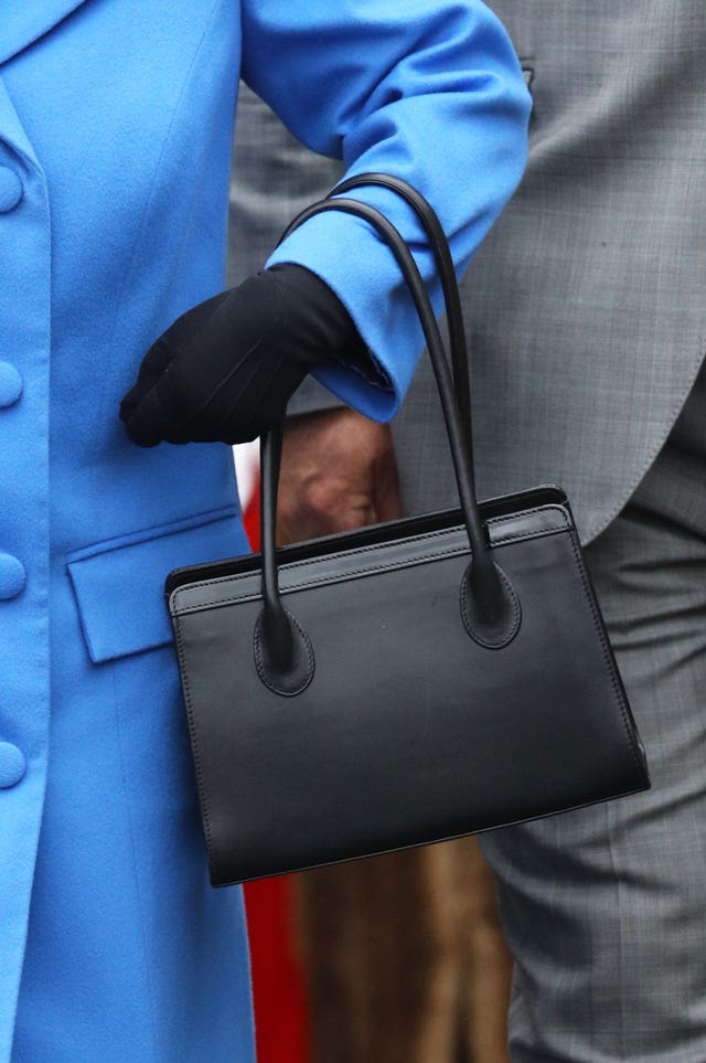 Detail of Queen Elizabeth II’s handbag during her visit at Haig Housing Trust, Morden, London, where she will officially open their new housing development for armed forces veterans and the ex-service community.