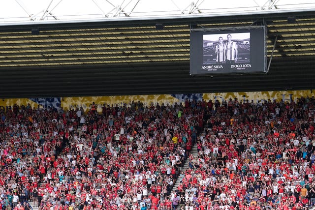 Liverpool fans stand and applaud in the 20th minute in memory of Diogo Jota during the pre-season friendly at Preston