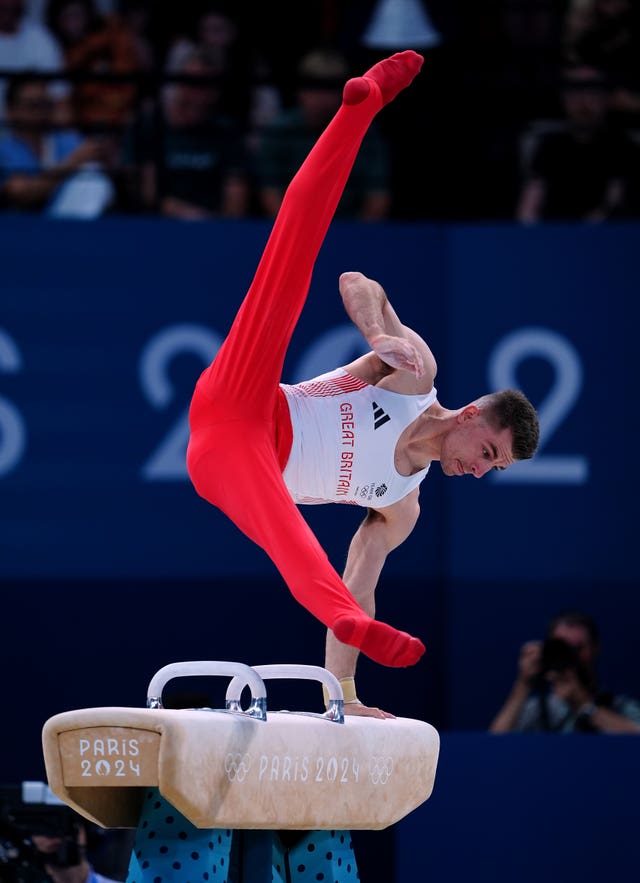 Max Whitlock performs on the pommel horse 