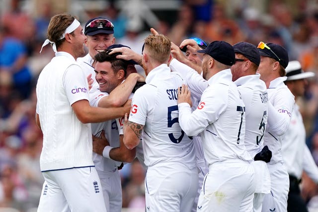 James Anderson (centre) is congratulated by teammates after taking the wicket of New Zealand’s Tom Latham 