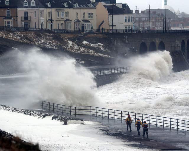 Tynemouth Life brigade volunteers at Cullercoats arrive to ask people to stay away from the coastline (Owen Humphreys/PA)
