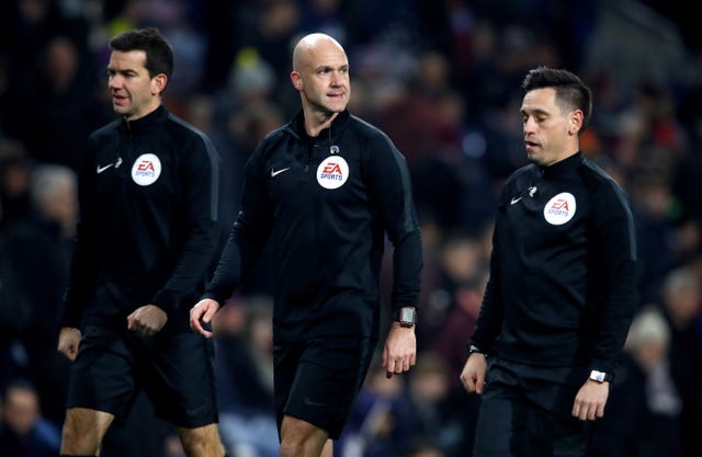 Referee Anthony Taylor (centre) with assistants Adam Nunn (left) and Gary Beswick.