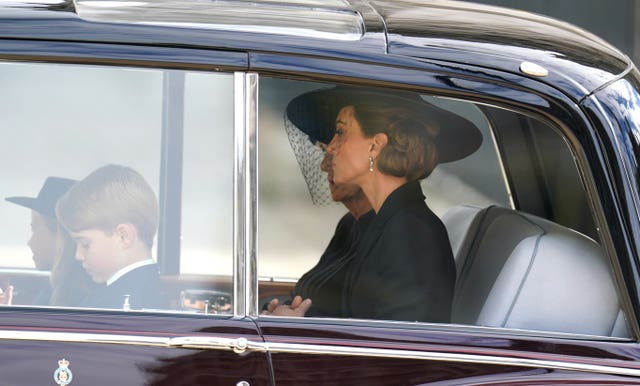 Prince George and the Princess of Wales leave in a car following the State Funeral of Queen Elizabeth II