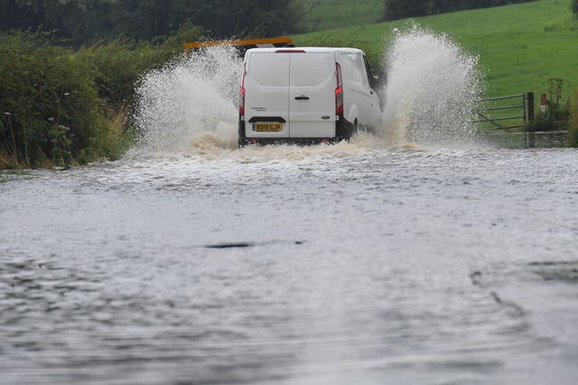 A van makes its way along Bonis Hall Lane in Cheshire 