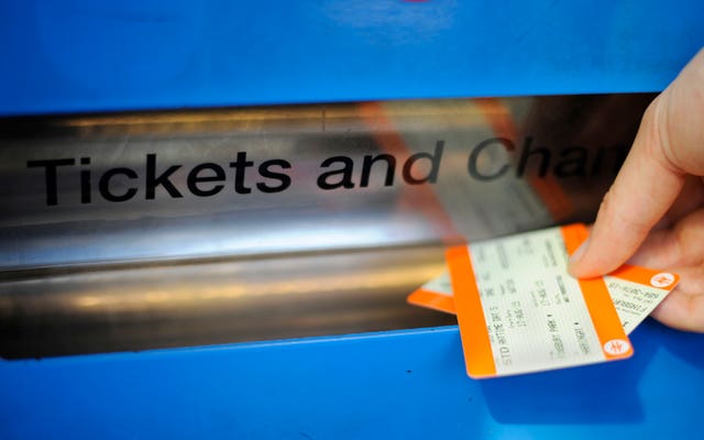 A person buying a train ticket