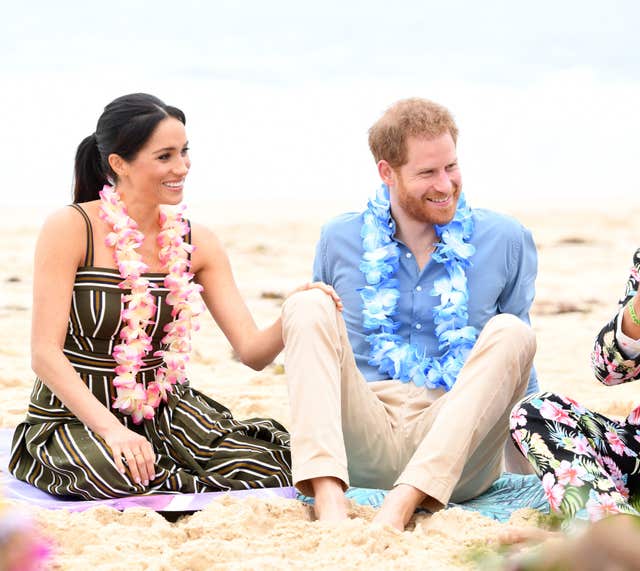 The Duke and Duchess of Sussex meet members of surfing community group One Wave during a visit to South Bondi Beach in Sydney