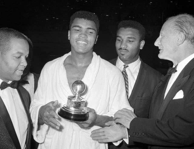 Muhammad Ali, second left,