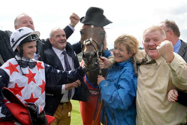 Adam McNamara with Tony Martin and delighted connections after the Ebor 