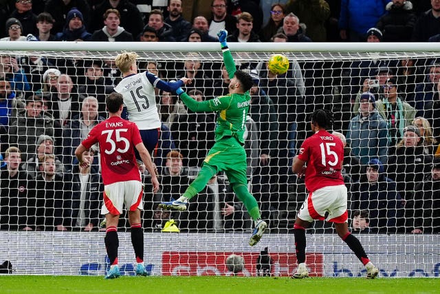 Manchester United goalkeeper Altay Bayindir (centre) fails to prevent Tottenham’s Son Heung-Min scoring a corner