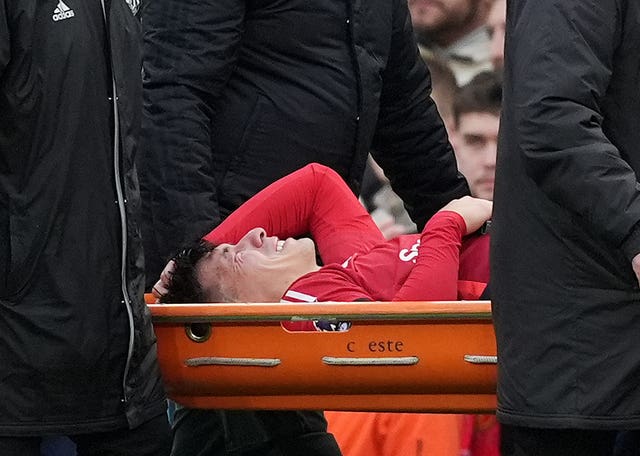 Lisandro Martinez is carried off the field