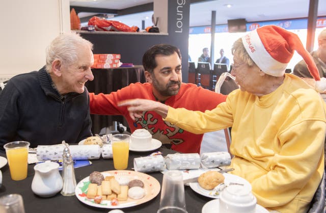 Humza Yousaf serving lunch