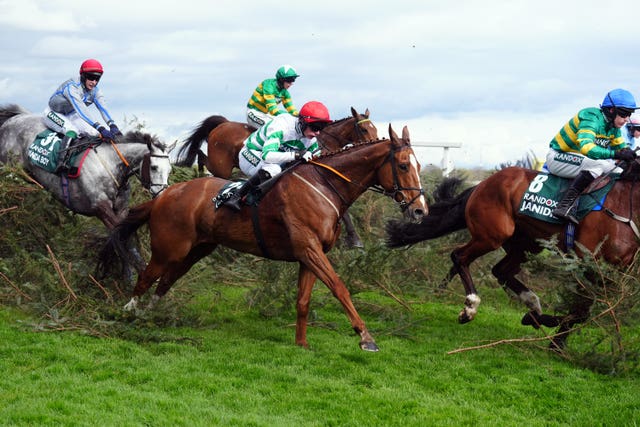 Danny Gilligan and Chemical Energy jump the Chair during the Randox Grand National 