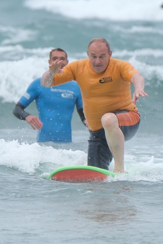 Sir Ed Davey gets on his surfboard