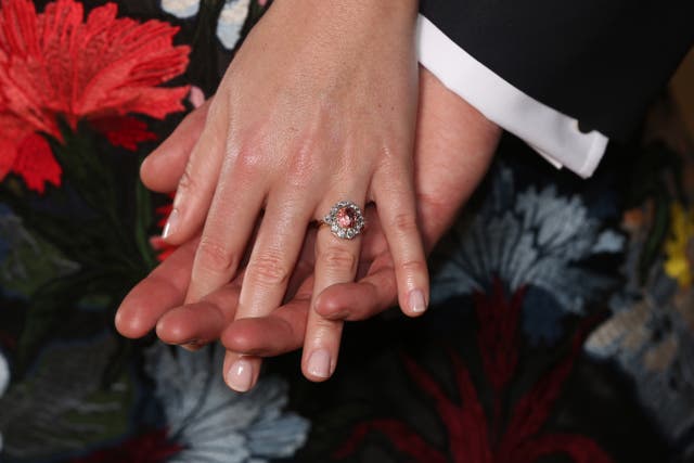 Princess Eugenie wears a ring containing a padparadscha sapphire surrounded by diamonds (Jonathan Brady/PA)