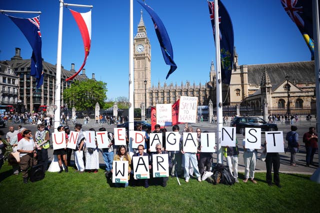 People take part in a demonstration in Parliament Square 