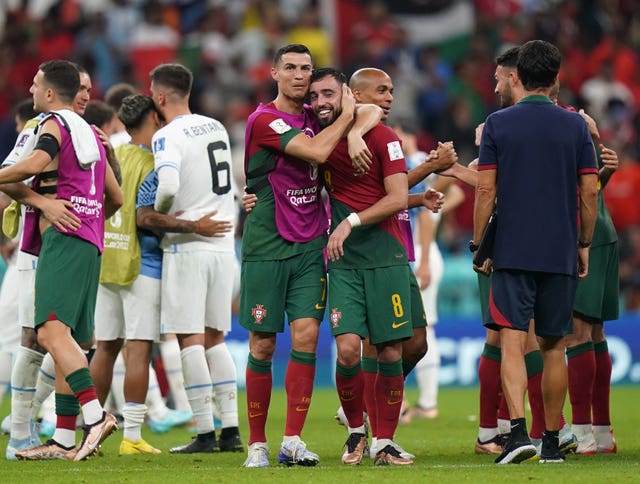 Cristiano Ronaldo, left, and Bruno Fernandes embrace