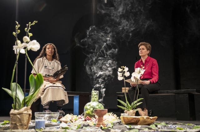 First Minister Nicola Sturgeon, right, during a special ceremonial gathering to welcome the Mapuche leader and Minga Indigena indigenous delegates at the Tramway in Glasgow in a symbolic gesture to mark a unified demand for climate justice