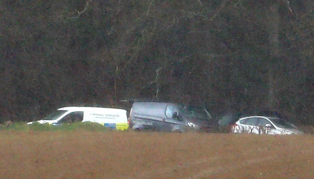 Police vehicles at search site