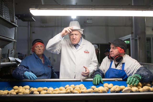 Boris Johnson during a visit to Tayto Castle crisp factory in Tandragee, County Armagh