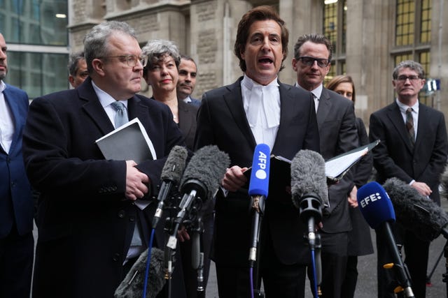 David Sherborne (right) speaking to the media outside the Rolls Building in London following the settlement (Lucy North/PA)