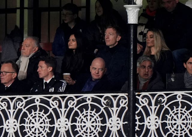 FIFA president Gianni Infantino watches on