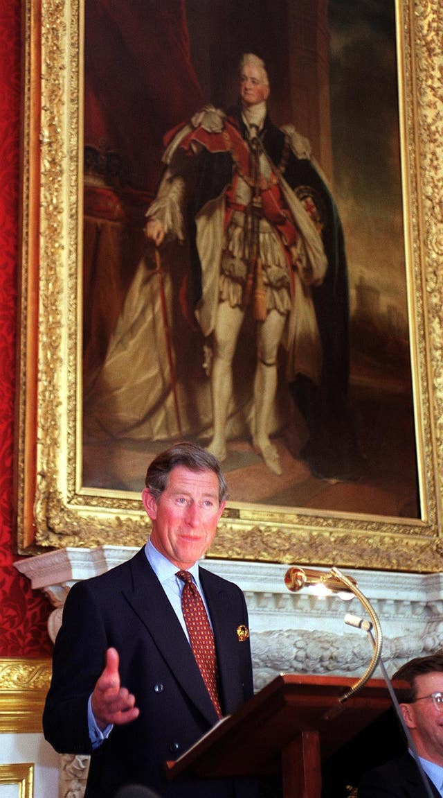 The Prince of Wales in front of a portrait of William IV in St James Palace (John Stillwell/PA)