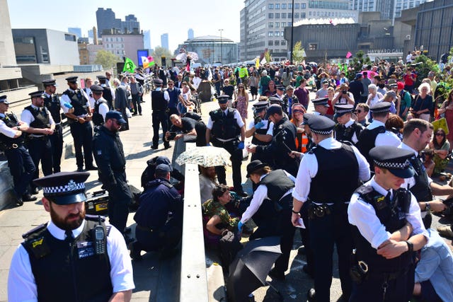 Police remove Extinction Rebellion demonstrators on Waterloo Bridge 