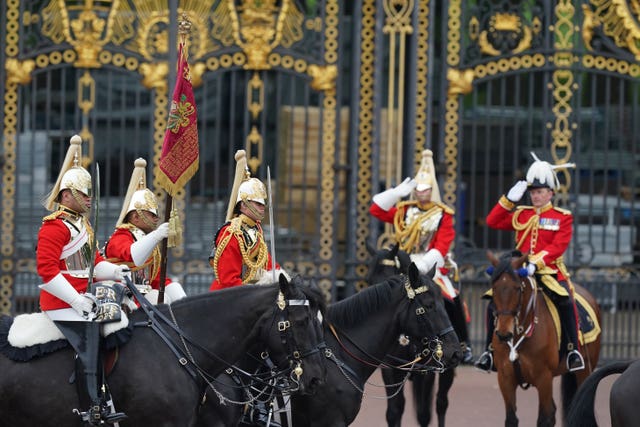 Lifeguards from the Household Cavalry outside Buckingham Palace ahead of the State Opening of Parliament in the House of Lords, London