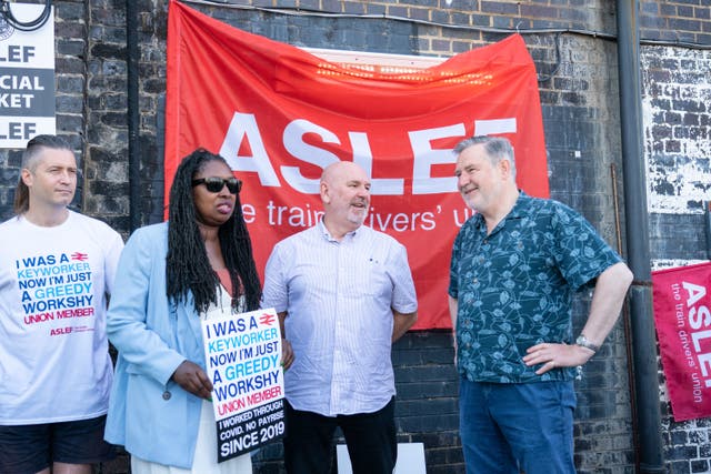 Aslef general secretary Mick Whelan (centre) speaks with Labour MPs Dawn Butler and Barry Gardiner at a picket line 