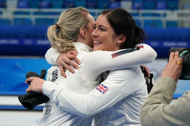 Eve Muirhead embraces team-mate Vicky Wright, left, after the win over Sweden