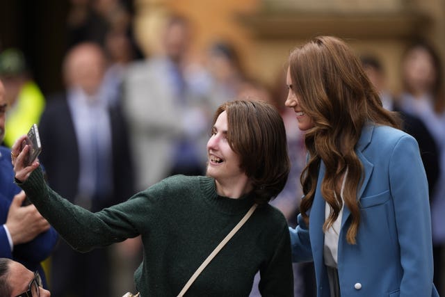 A woman takes a selfie with the Princess of Wales