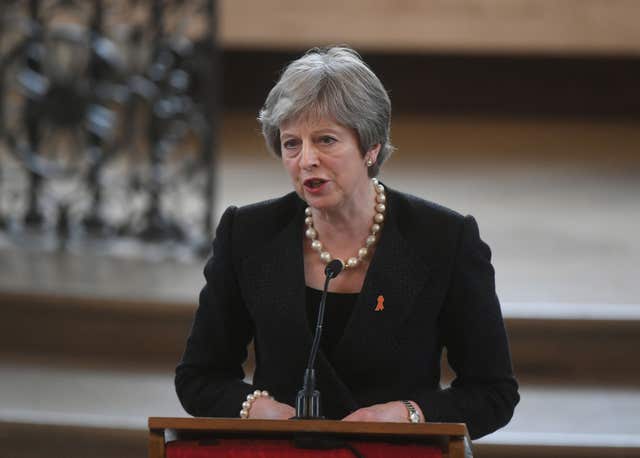 Theresa May speaking during the memorial service