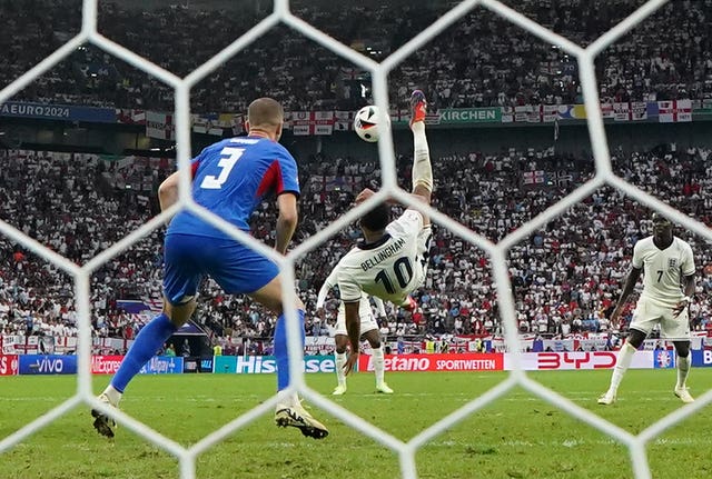 Jude Bellingham, centre, scores England’s equaliser against Slovakia with a bicycle kick