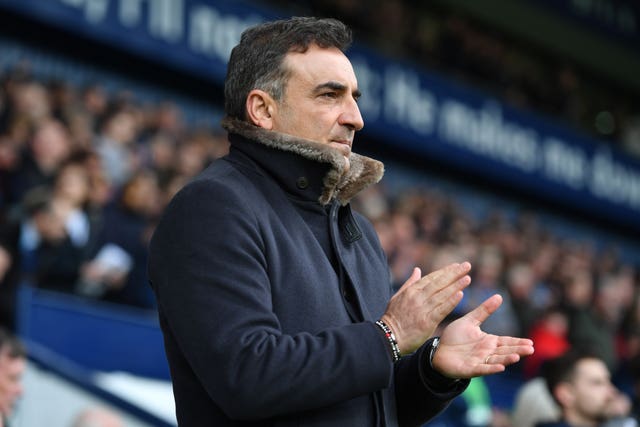 Swansea manager Carlos Carvalhal joins in with a minute's applause ahead of his side's match at West Brom